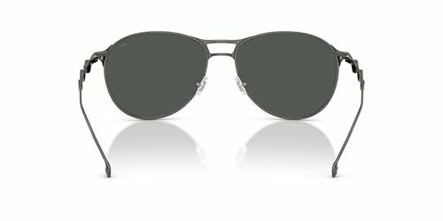 Front view of stylish sunglasses with dark lenses and metal frame.